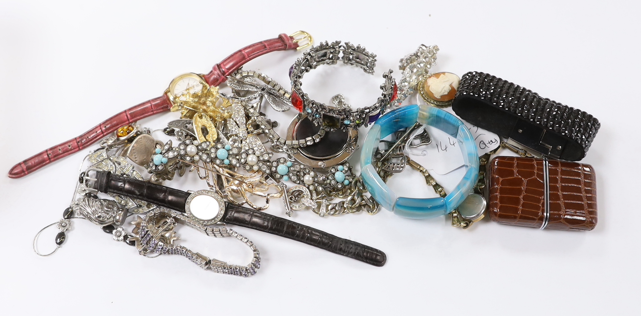 A group of assorted costume jewellery including marcasite and paste set, a Tiffany & Co sterling key ring, a 925 and amber set elephant brooch, blue agate bracelet, wrist watches, travelling watch, etc.